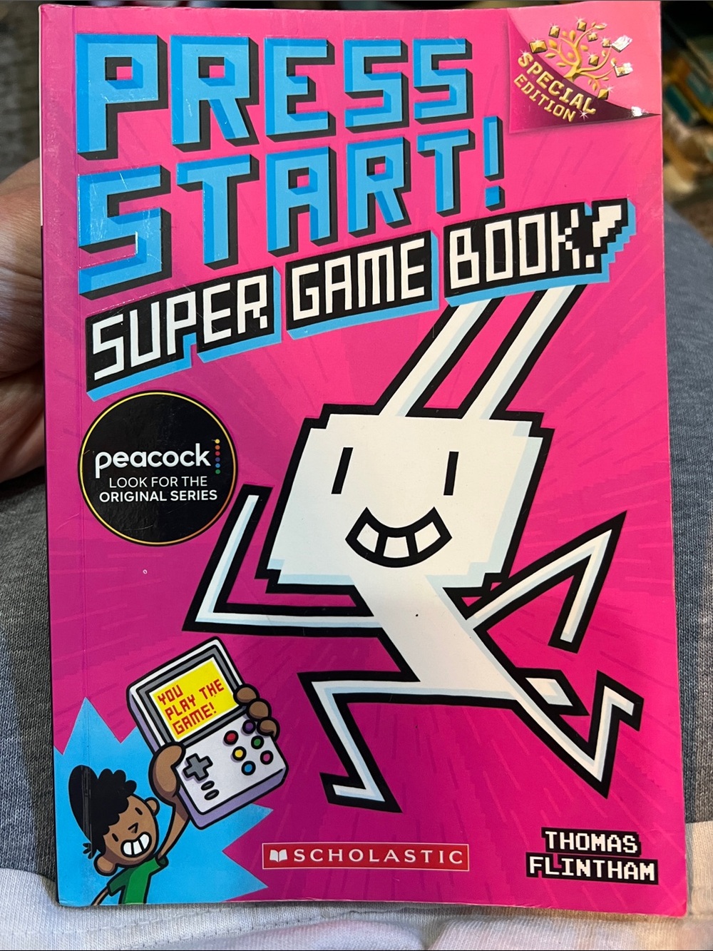 Scholastic Bright Pink "Press Start! Super Game Book"